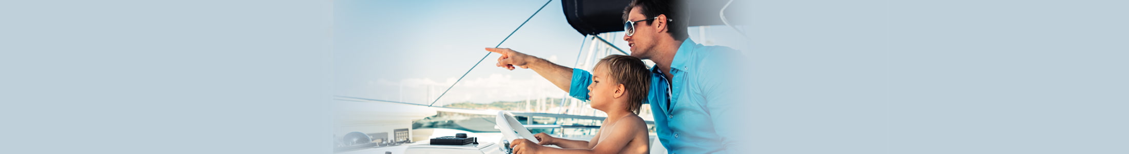 father and son on a boat